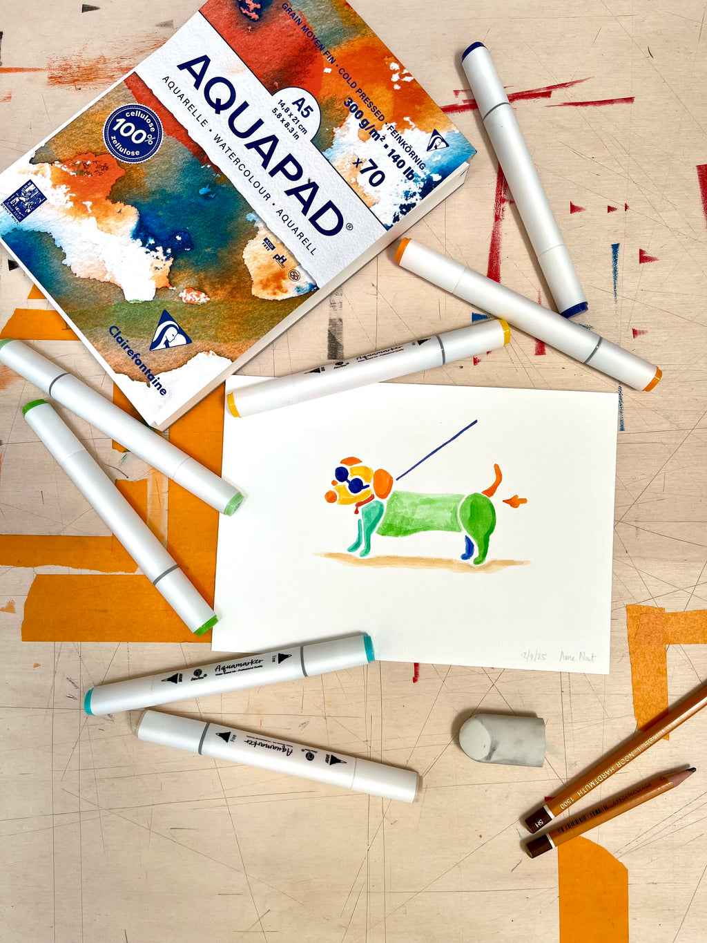 Benodigdheden voor tekening van teckel die scheetje laat door Anne Neuteboom cabaretier Anne Neut Boetiek