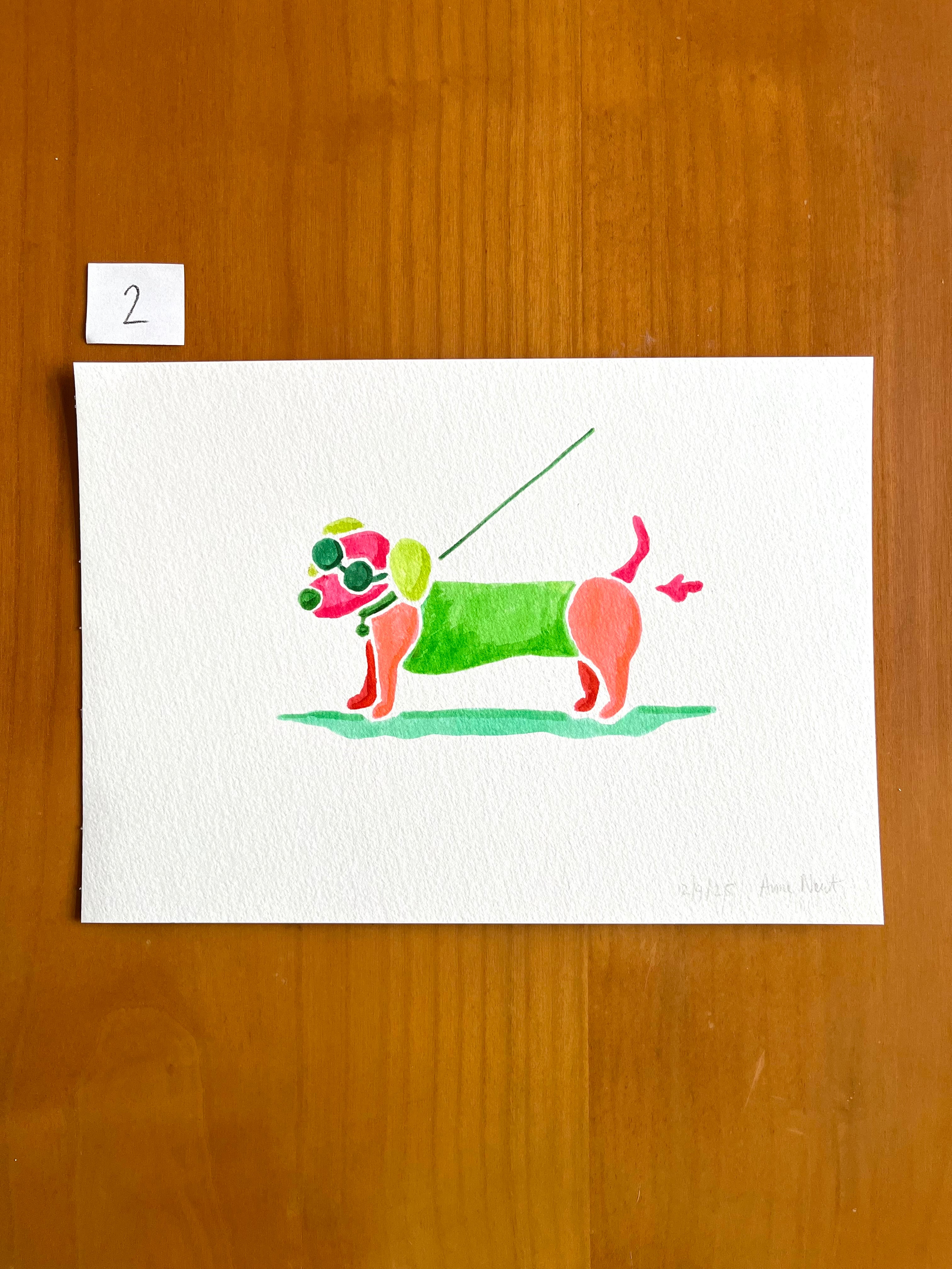 Tekening van teckel die een scheetje laat met aquarel markers op aquarel-papier door Anne Neuteboom cabaretier Anne Neut Boetiek